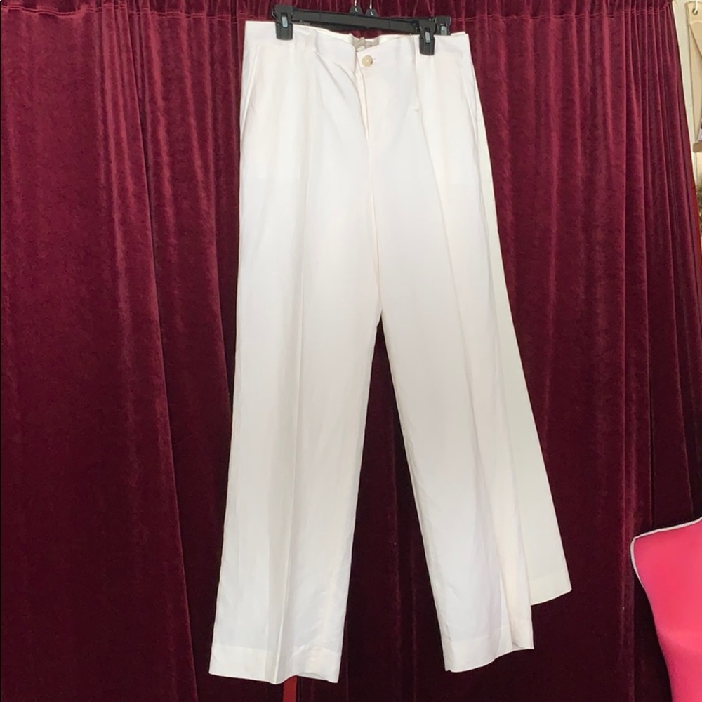 White trousers with brown button